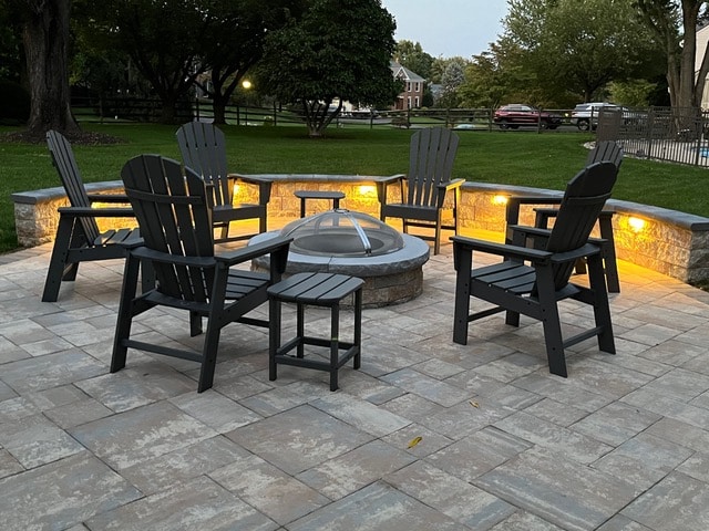 new patio installation with firepit and under bench lighting