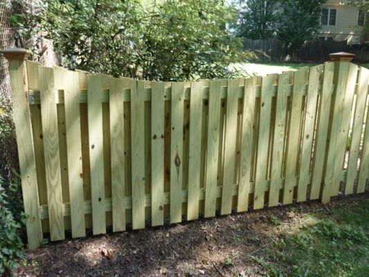 Wooden fence with lattice top