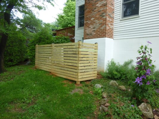 Wooden privacy fence with decorative top