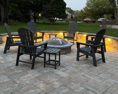 new patio installation with firepit and under bench lighting